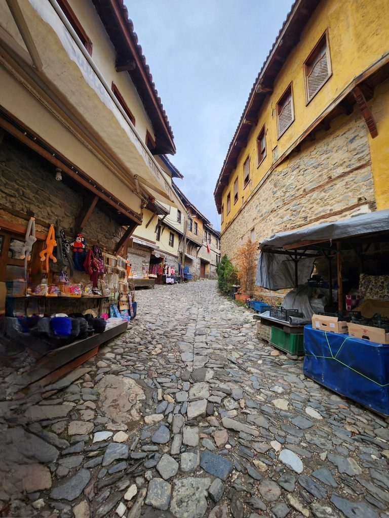 Wooden houses, stone paths, and narrow alleys filled with the old-world charm of the Ottoman Empire era