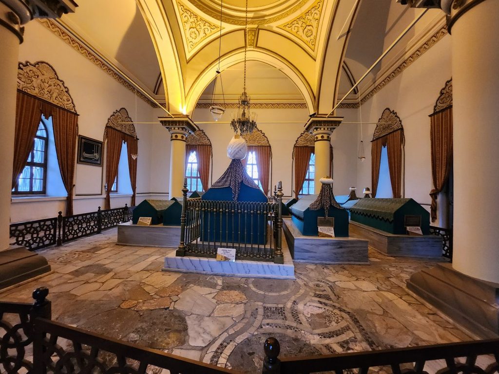 Inside the tomb of Orhan I (Orhan Gazi Türbesi), son of Osman I, who founded the Ottoman Empire. The coffins (catafalks) of the sultan and his family, covered in blue cloth and adorned with splendid Islamic-style fabric decorations, are enshrined here.