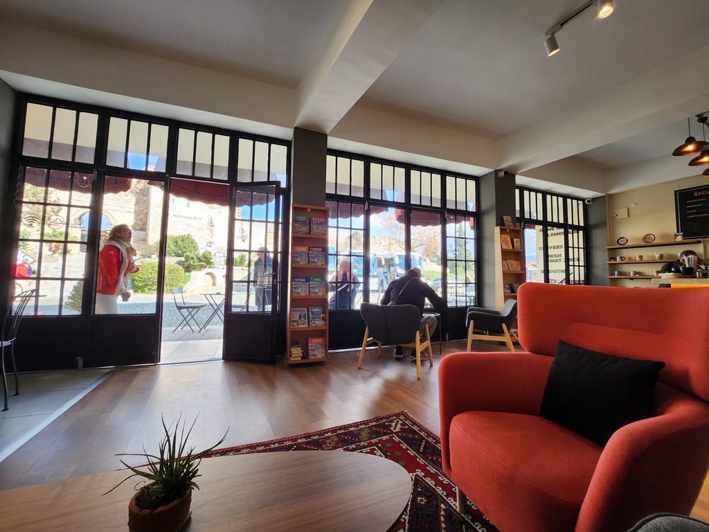 Kallinos Cafe, a charming local spot offering scenic views of the historic ruins and citadel walls.