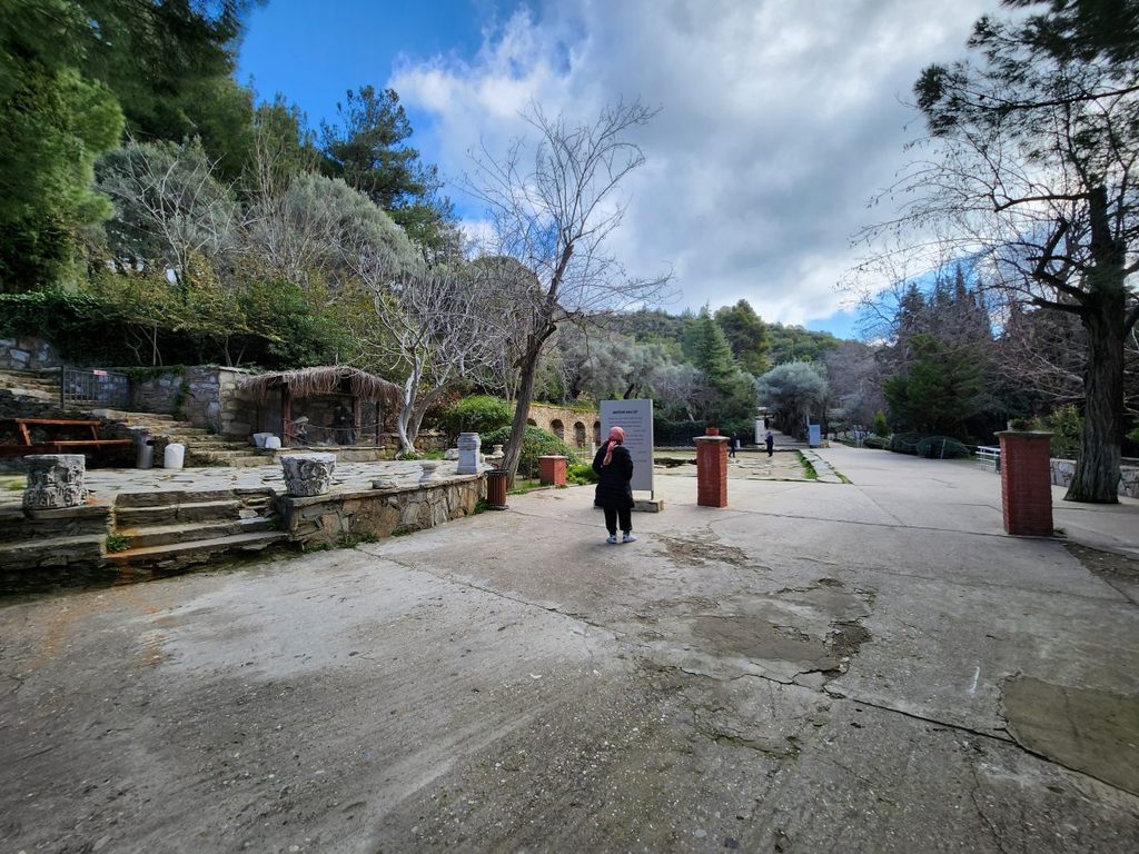 The serene, tree-lined pathway leading to the sacred House of the Virgin Mary on Mount Bülbül.